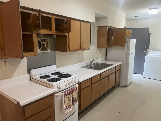 Renovated kitchen with new appliances and fixtures. 