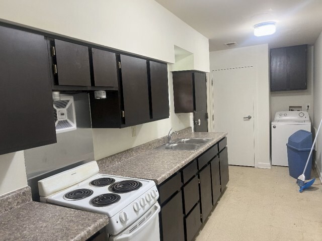 New cabinets, oven, refridgerator and washing machine. 