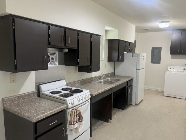 Newly renovated kitchen with new cabinets, appliances, and fixtures. 